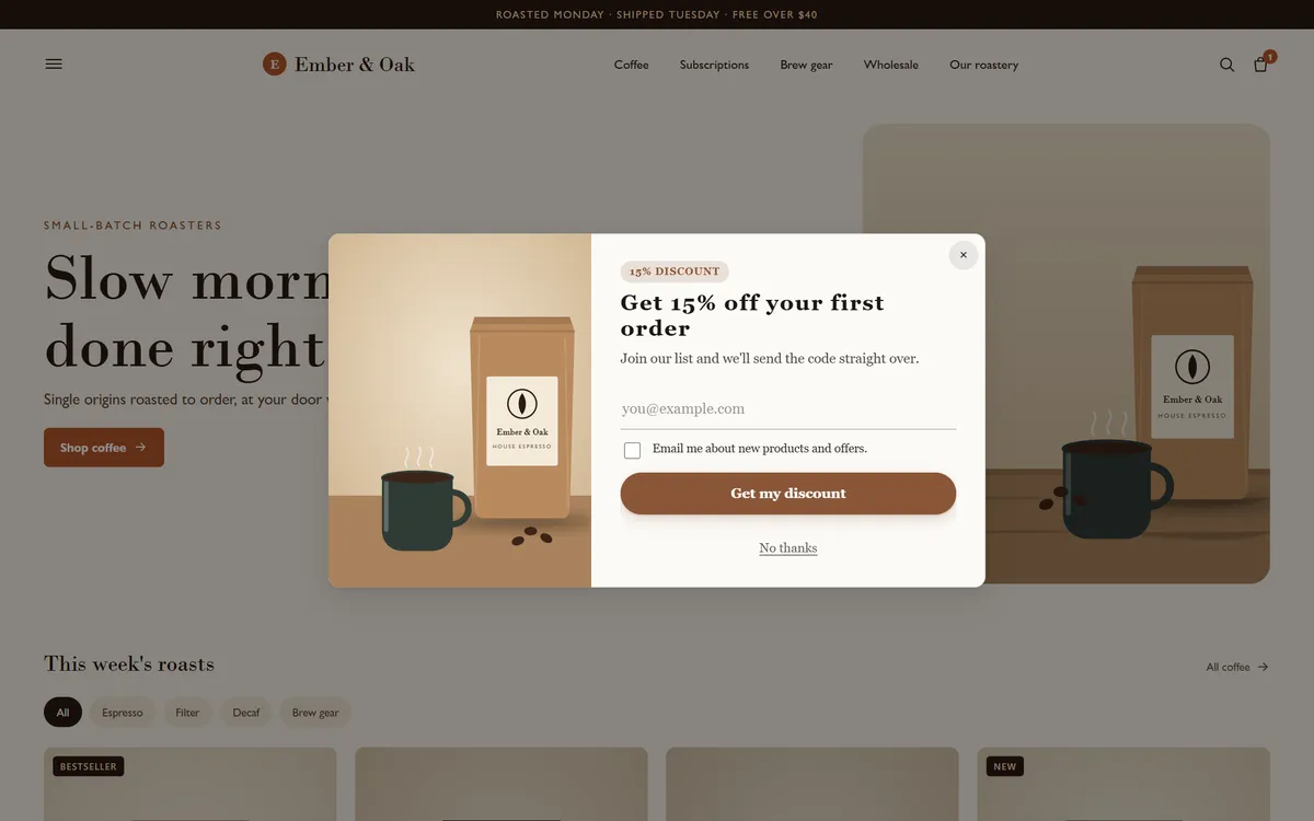 A coffee roaster's store with an announcement bar across the top and a split popup in the middle: a product photo beside “Get 15% off your first order”, an email field, a consent box and a “Get my discount” button.